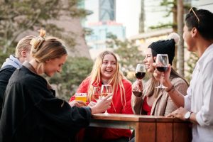 Team enjoying drink at lucky shag bar 11